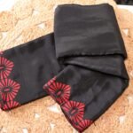 Black Saree with Bold Red Floral Geometric Border Design