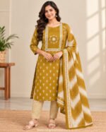 Woman wearing mustard yellow floral printed kurti with cream geometric pants and matching printed dupatta – Naayika Online