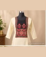 Cream kurta set with black floral yoke, matching cream bottom and black traditional printed dupatta.