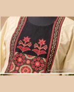 Cream kurta set with black floral yoke, matching cream bottom and black traditional printed dupatta.