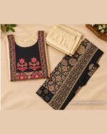 Cream kurta set with black floral yoke, matching cream bottom and black traditional printed dupatta.